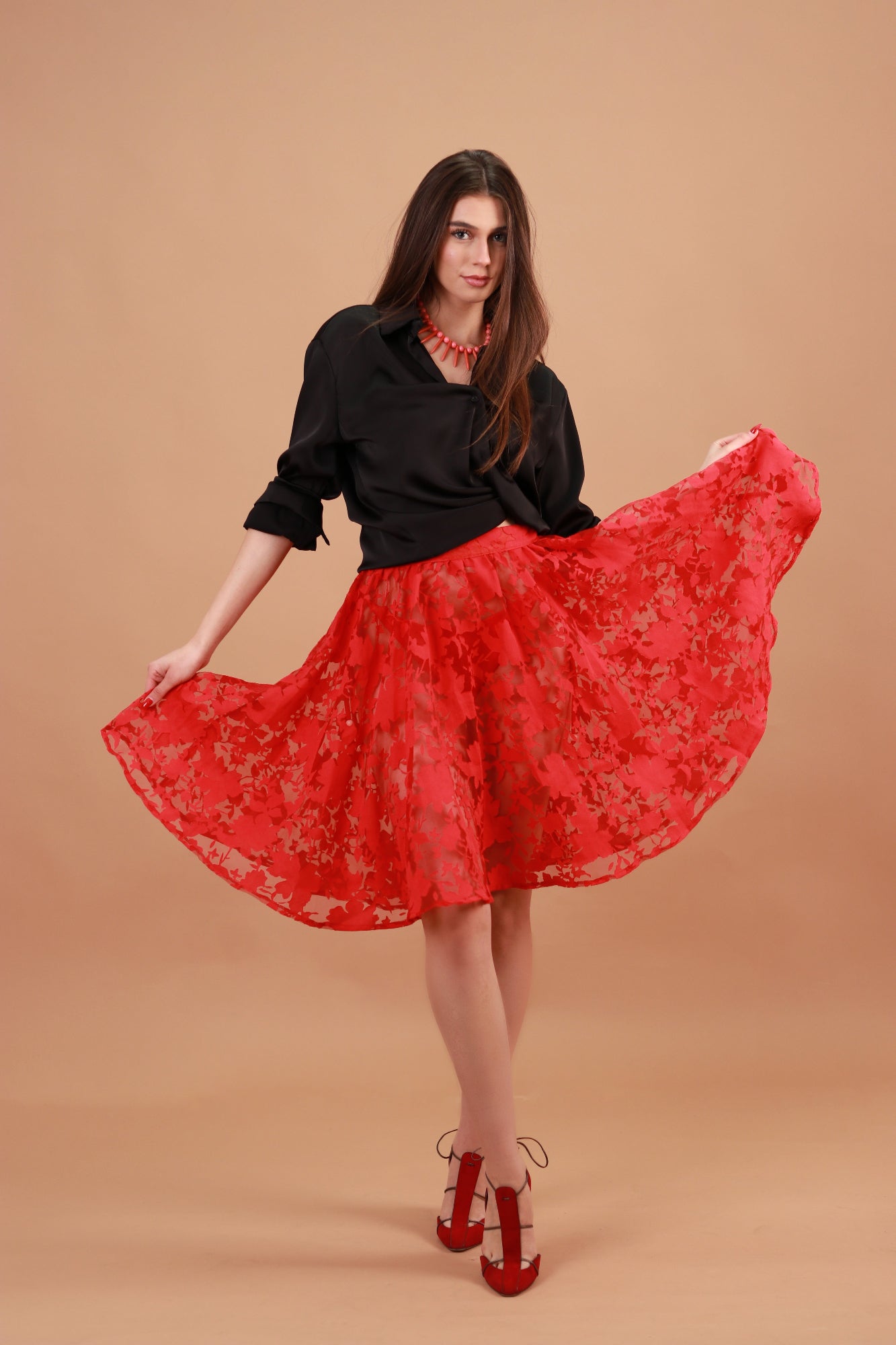 PARAÏMA RED SEE-THROUGH SKIRT WITH LEAVES