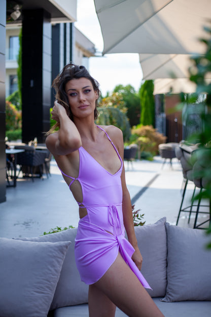 Model in exclusive swimsuit by Paraima designer Croatian swimwear named Volosko Sunset in the color Lilac Sunbeams
