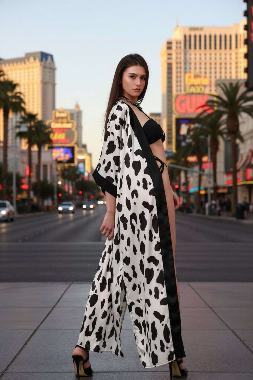 Model wearing the Black Nights color of the Volosko Sunset bikini with the Holy Cow kimono as beach cover up