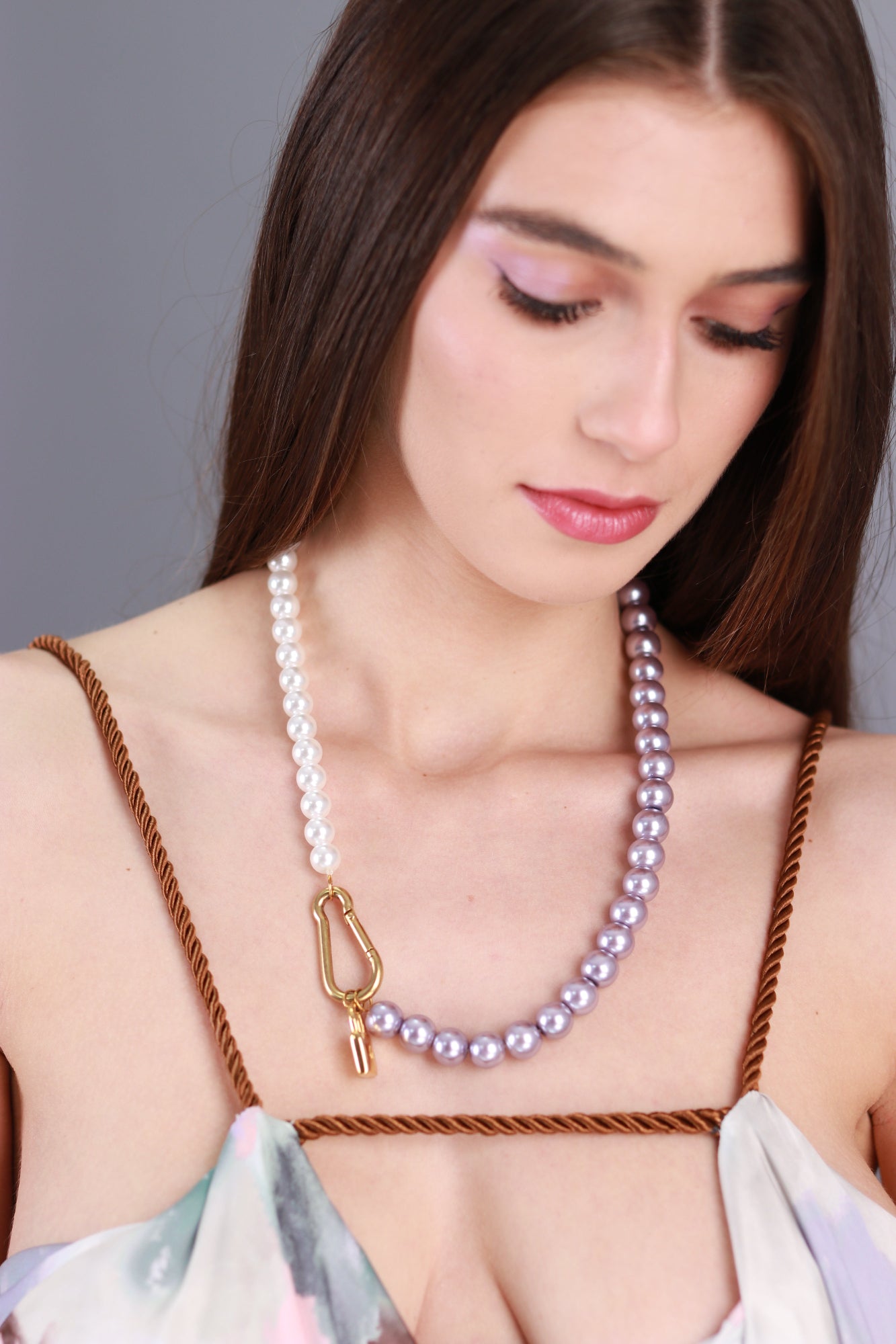 necklace with a lock violet and white pearls